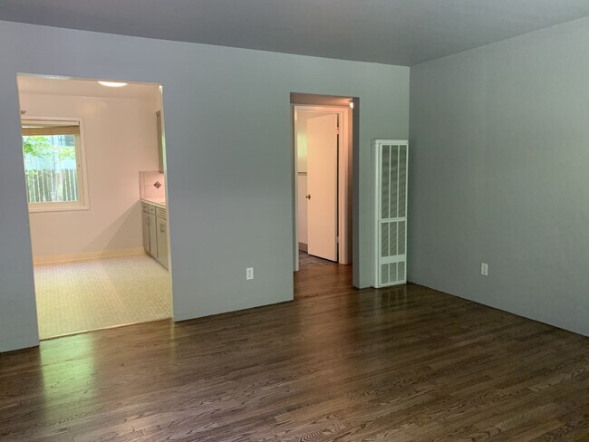View from the front door toward kitchen on the left and bath and hallway on right. - 1624 T St