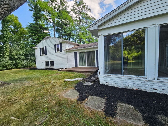 Building Photo - Private 4 Bedroom Home on 0.75 Acres with Great Room Fireplace, Wet Bar & 3-Season Room, 2 Car At...