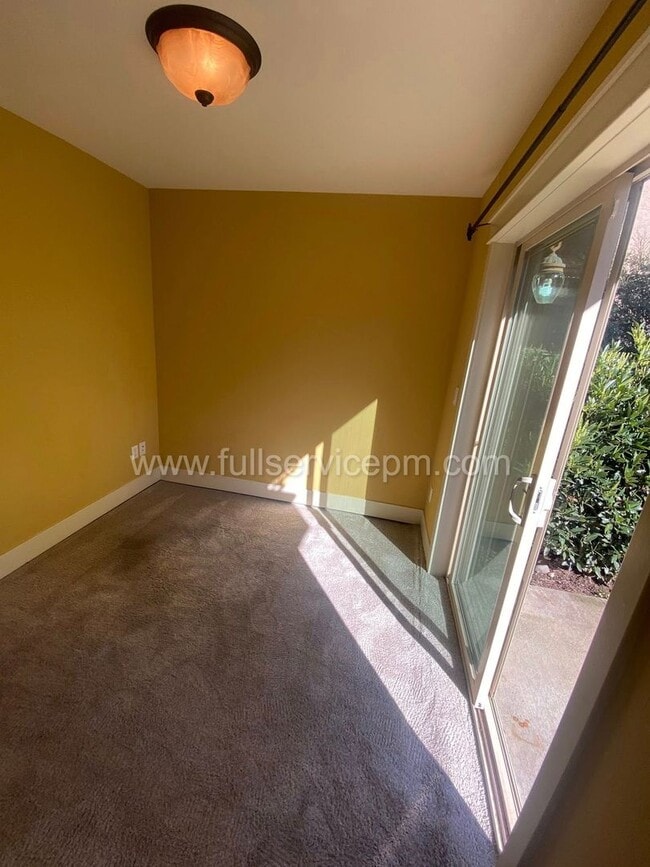 Building Photo - Spacious townhome with private backyard, garage parking, multiple decks, and a dedicated home off...