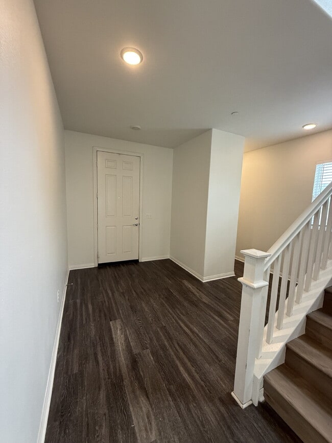 Building Photo - New flooring & paint!  Large backyard - landscaped and ready for garden!   Community pool, fitnes...