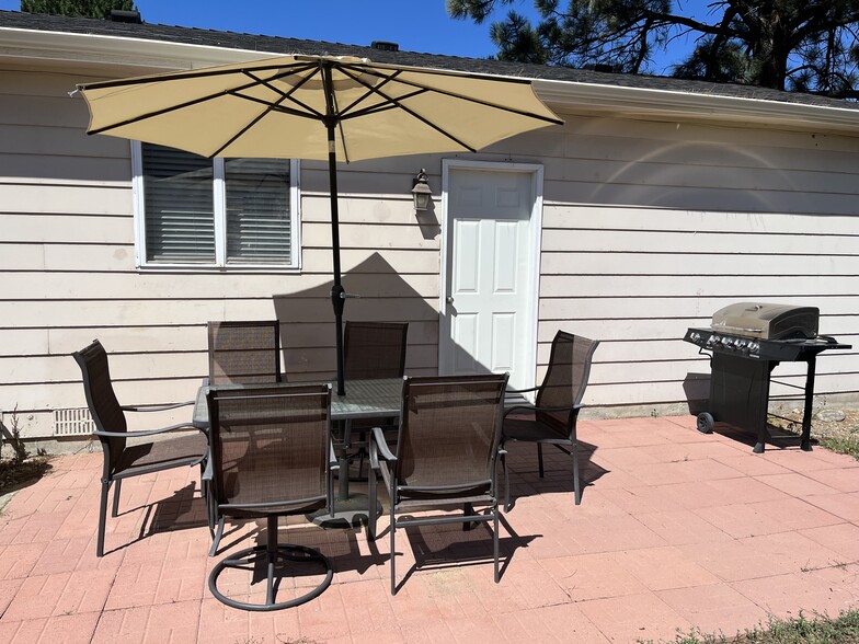 Back patio with a grill for BBQ'ing - 14532 E Radcliff Dr