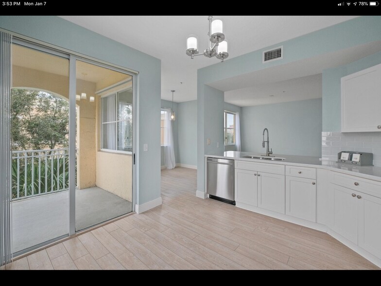 Kitchen with slider to balcony - 11041 Legacy Blvd