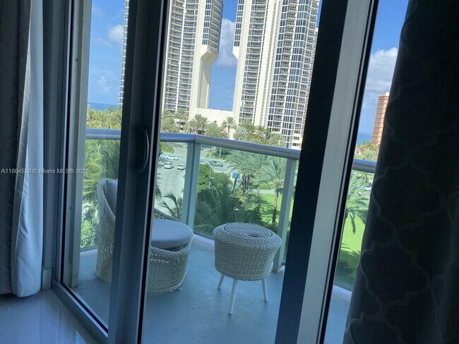 Building Photo - 19370 Collins Ave