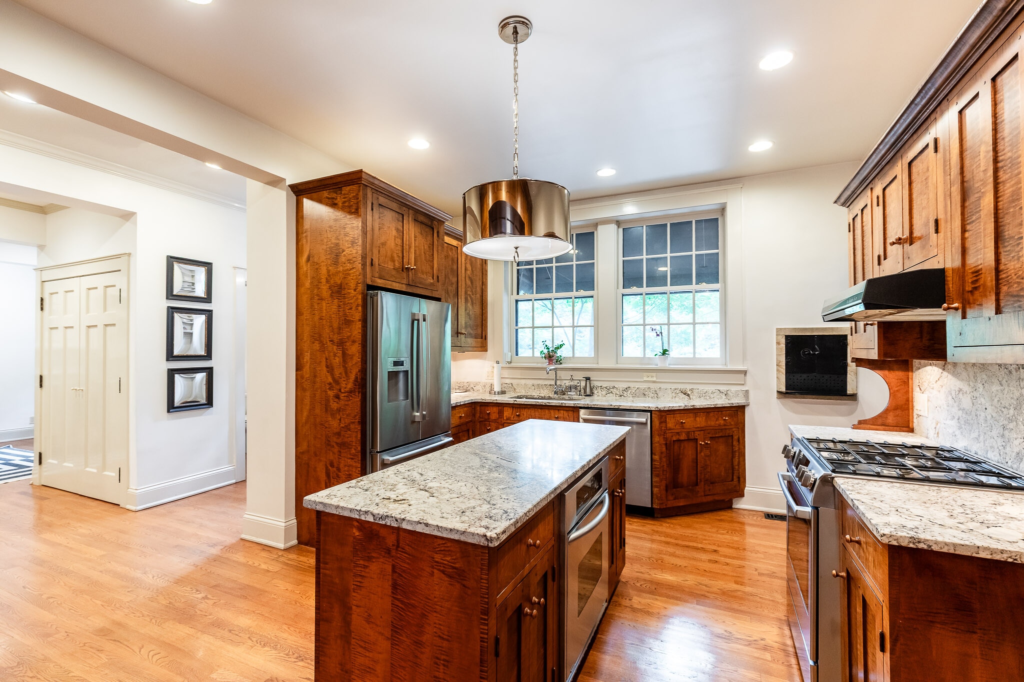 Kitchen includes granite counters, high end appliances and opens to entertainment deck. - 4061 Beechwood Ave