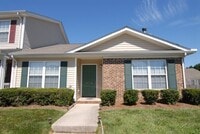 Building Photo - Charming 3 bedroom 2 bath Townhouse w/ fenced in yard located off Guilford College Road!