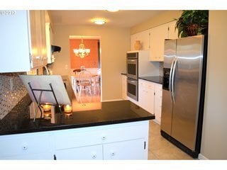 Building Photo - Quiet and Private Set in Forested Neighbor...