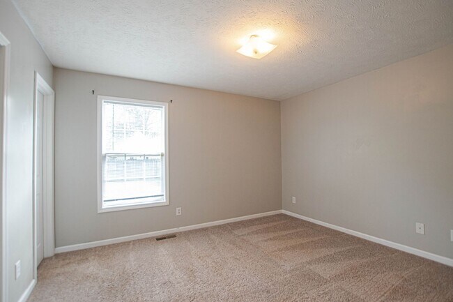 Building Photo - Pet Friendly with Fenced Yard!