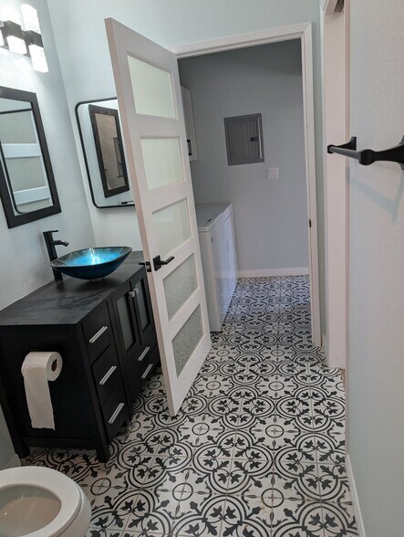 Tiled Floor in Bath/Laundry Room - 6719 Rudnick Ave