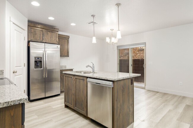 Building Photo - 3 bed | 2.5 bath | 2-car Townhome with Was...