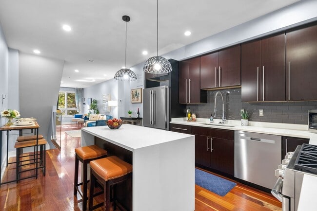 Building Photo - Stylish 2-Level Condo with Private Yard & Chef’s Kitchen Near Petworth Metro!