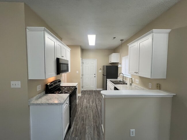 Building Photo - Welcome to Timbertop5127, a well-appointed 4-bedroom, 2.5-bath home in Charlotte, NC.