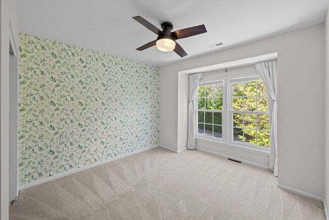 Building Photo - Completely Renovated Corner Townhome with Modern Kitchen, Designer Baths, and Private Yard