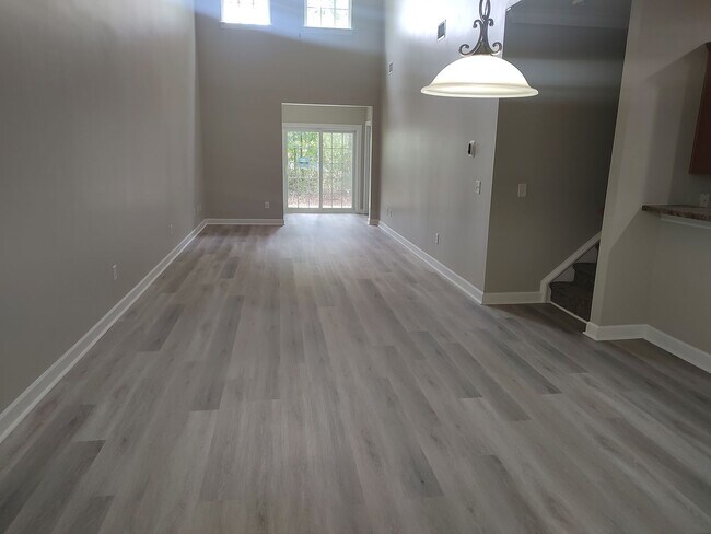 Building Photo - BRAND NEW FLOORING & FRESH PAINT - 3 Bedroom/2.5 Bath Townhome with garage in Wild Wing!
