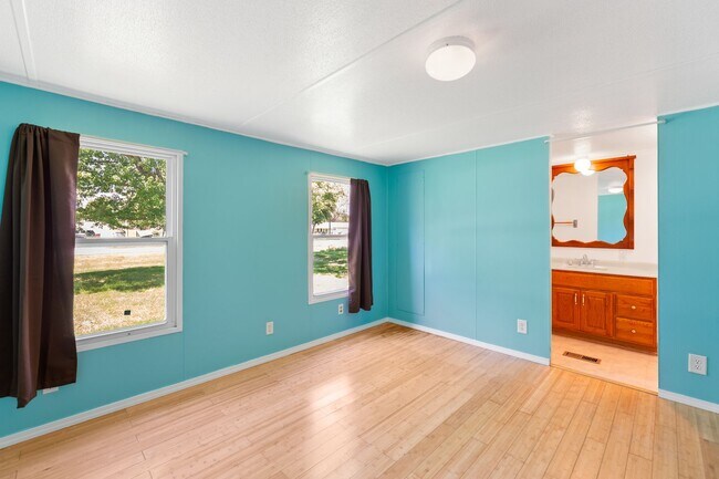 Building Photo - Updated mobile home on acre lot with garag...