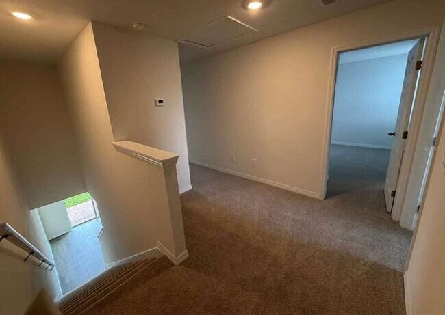 Building Photo - "Spacious 3-Bedroom Townhouse with Granite Elegance in St. Cloud – 4543 Rangeland Way"