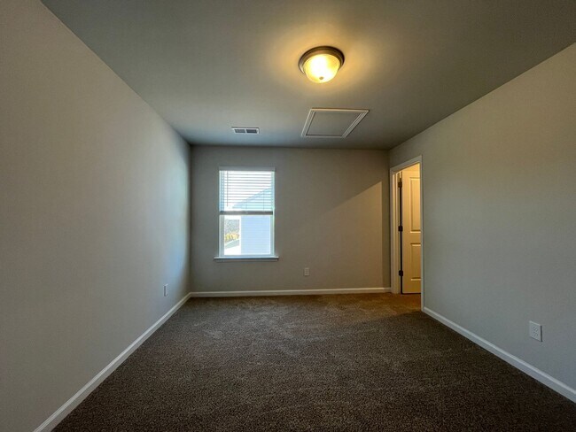 Building Photo - New 4/3 Townhome Available Now