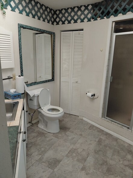 Toilet, shower and large storage area - 5720 24th St W