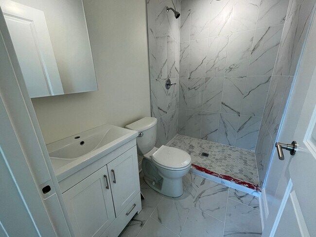 Building Photo - Brand New Renovation! 3 BR/ 2 BA On Quiet ...