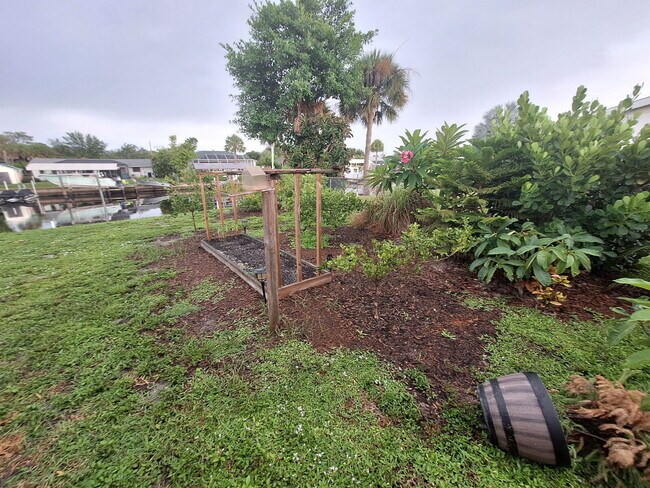 Building Photo - Gulf Access Home on Canal Available Now