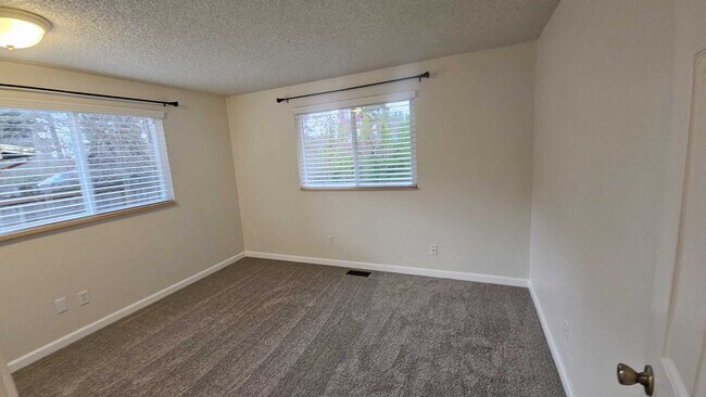 Building Photo - Charming updated 3 bed 1 bath ranch style home with double car garage and large fenced back yard.