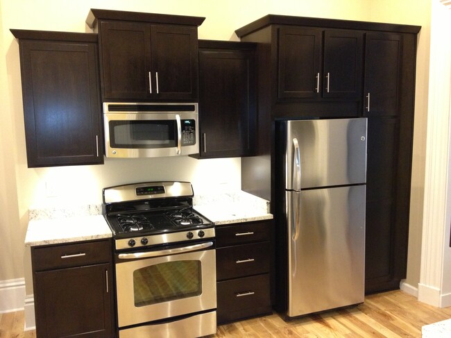 Kitchen with granite countertops and stainless steel appliances - 3515 Penn Ave