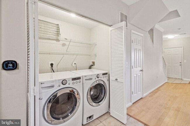 Building Photo - This townhouse style condo is located across the street from the Vienna Metro Station (Orange Line).