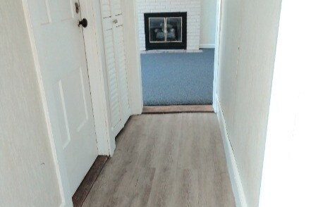 Laminate flooring in hall - 10479 Protection S Rd