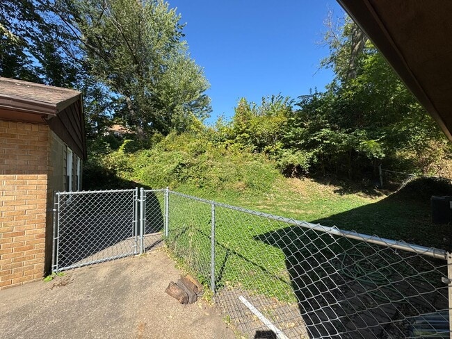 Building Photo - Large Moline Home with 3-Car Garage, Privacy, and Plenty of Space