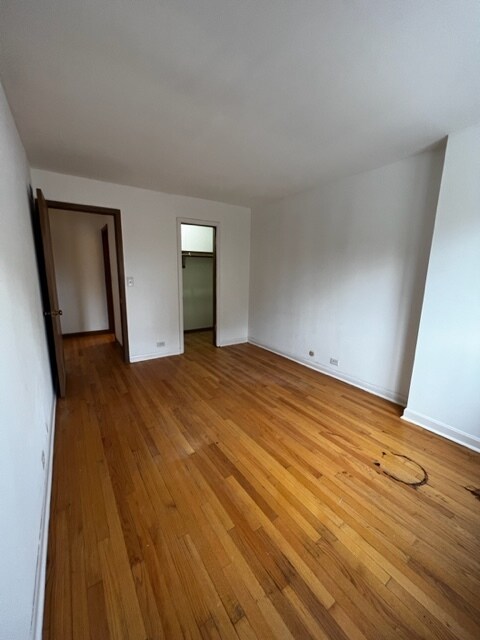 Bedroom with deep closet - 6840 W North Ave