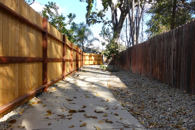 Private walkway with code secured gate - 23402 Collins St