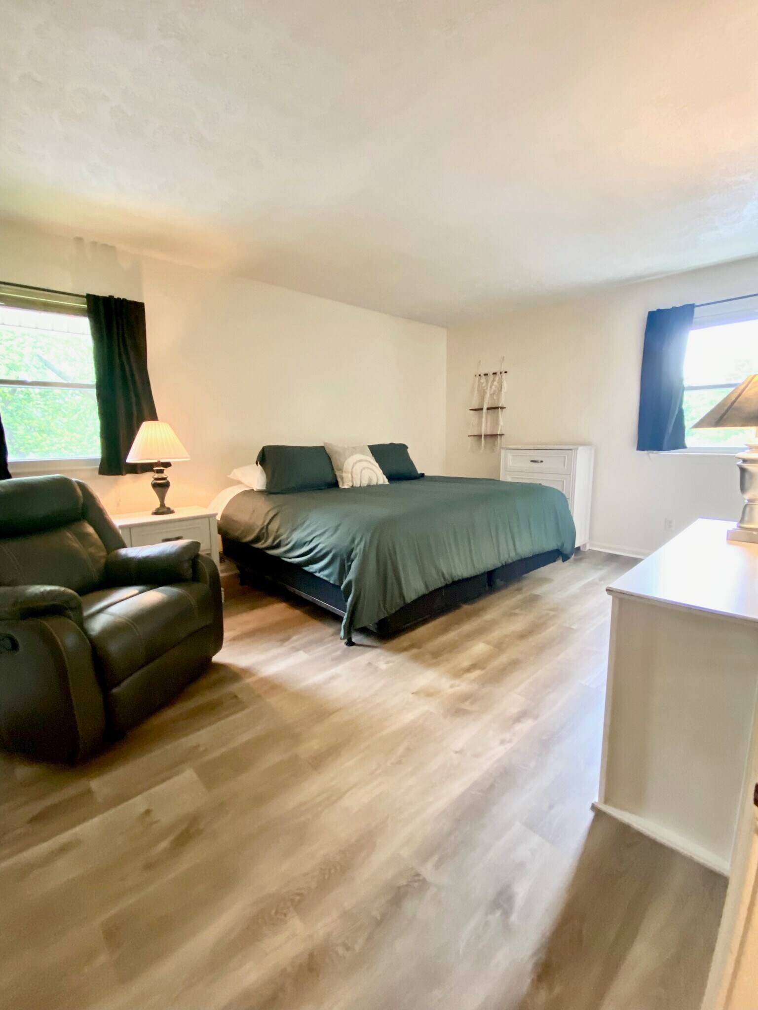 Master bedroom with king bed and recliner - 145 E Wellington Ave