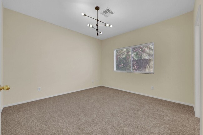 Building Photo - This beautifully updated 2-bedroom home is nestled in a gated community