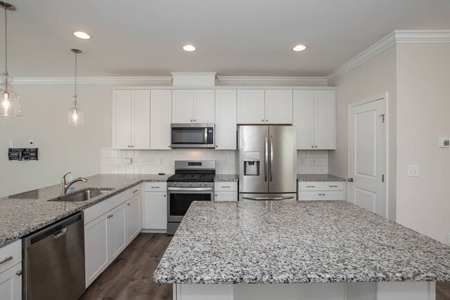 Building Photo - Four Bedroom Townhome!