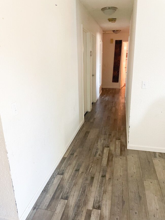 Hallway from family room towards bathroom and bedrooms - 25770 Mariposa St