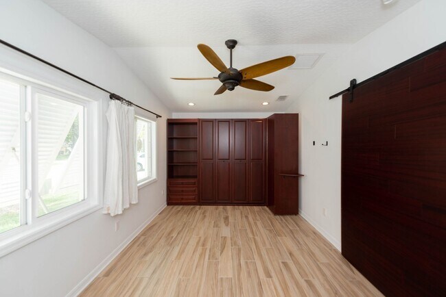 Building Photo - Live the ultimate Space Coast waterfront lifestyle at this stunning beachside canal home in Satel...