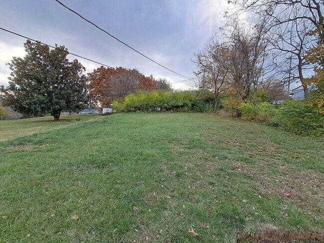 Building Photo - COMING SOON: Fully Renovated, Full of Charm — Space, Style, and a Porch Swing Vibe