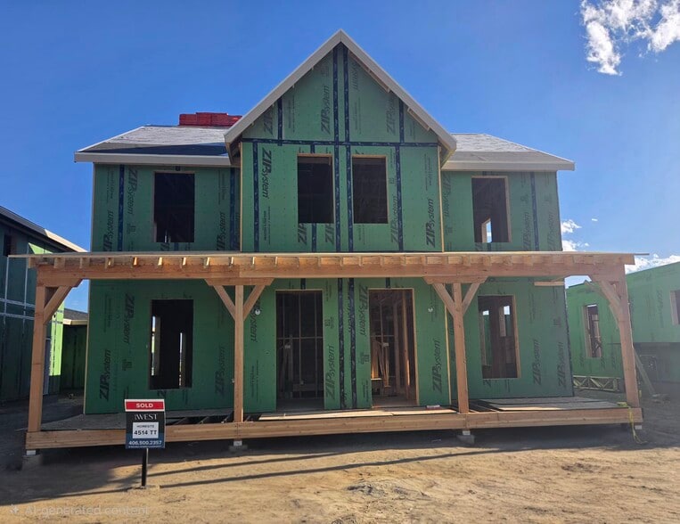 Active construction progress showing the covered front porch and private entryway framing. - 4510 Tippet Trl