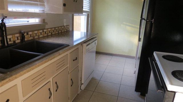 kitchen with granite counter tops and dishwasher. - 1505 E. Hayden Street