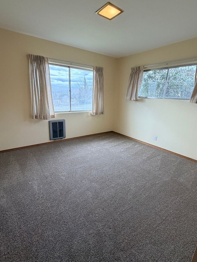 Building Photo - Country like setting! Spacious 3+ bed/ 1.5 bath house with garage, large yard, private deck and a...