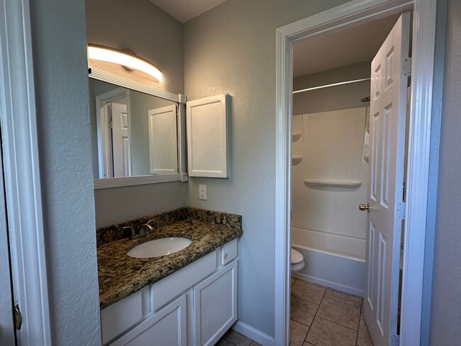 Building Photo - TOWNHOME WITH WATER INCLUDED AND TWO CAR GARAGE