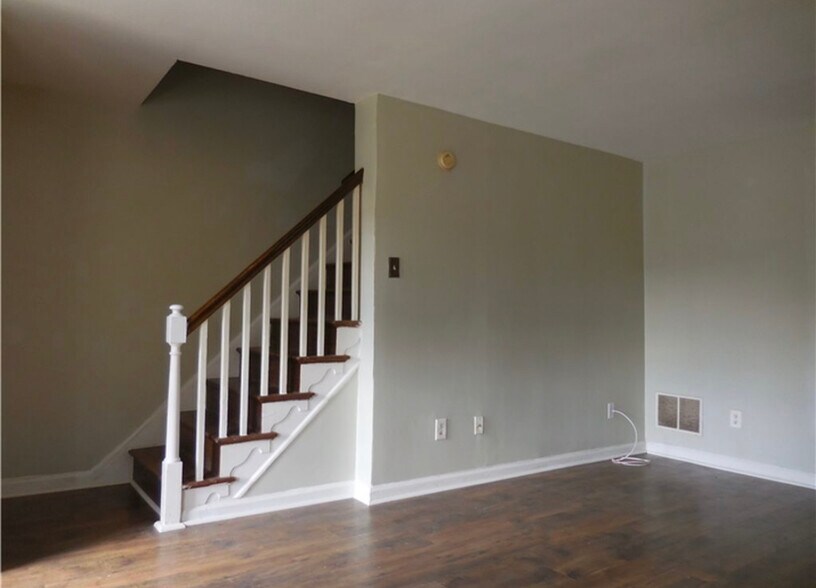 Living Room / Stairs - 123 Madison Dr