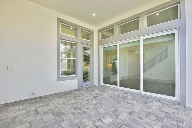 Building Photo - Gorgeous 4/3 Residence with a Private Back Lanai and a 2 Car Garage in the Delightful Laureate Pa...