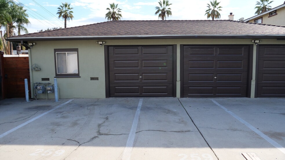 Two enclosed garages and two car ports. - 259 E Puente St