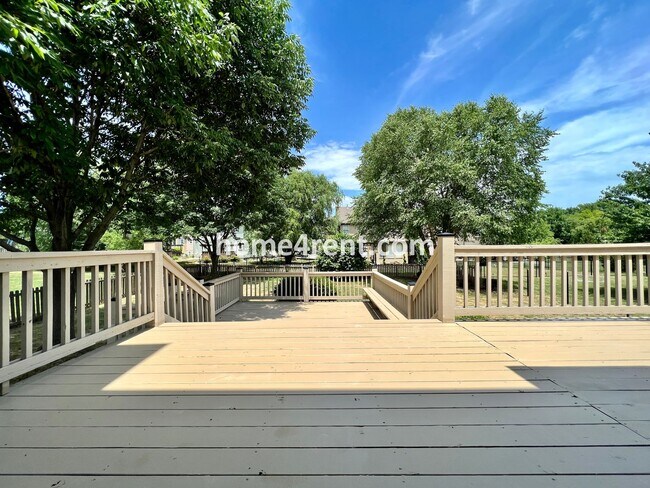 Building Photo - Updated Kitchen, Large Two Tiered Deck, Finished Basement in Blue Valley Schools!