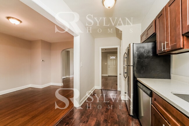 Building Photo - Welcome to this charming abode.