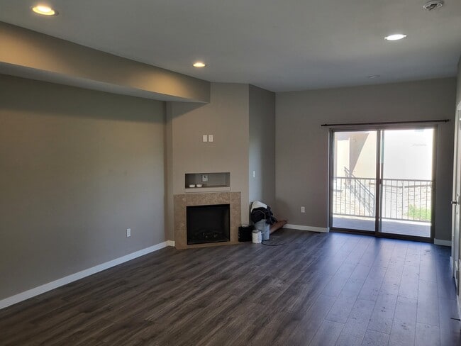 Large Living Room with Fireplace and Balcony - 3155 E 104th Ave