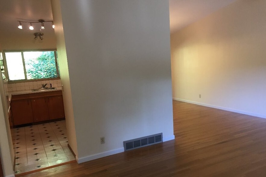 Open area showing Living Rm opening to kitchen - 8700 25th Ave NE