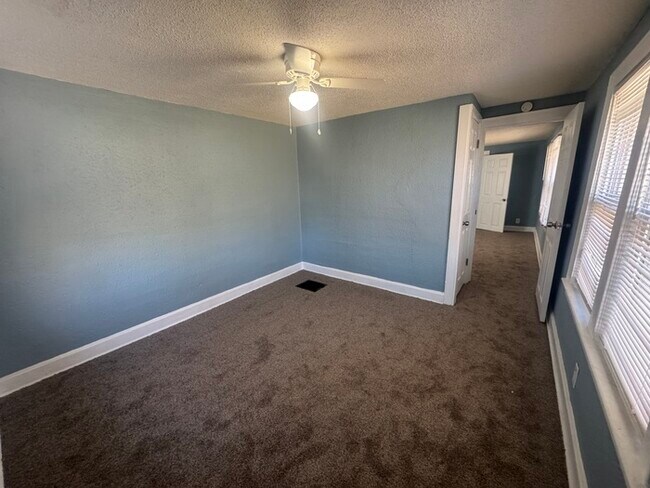 Building Photo - Charming 3BR 2BA Home w/ Fenced Yard + Covered Porch in KC