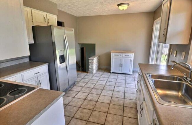 Building Photo - Beautiful 4-Bedroom Home on Spacious Corne...