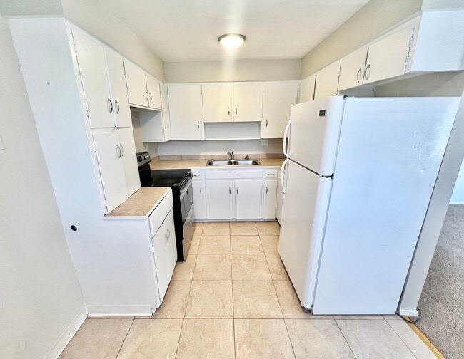 Experience the elegance of a modern kitchen design, perfect for culinary adventures. - Westland Apartments